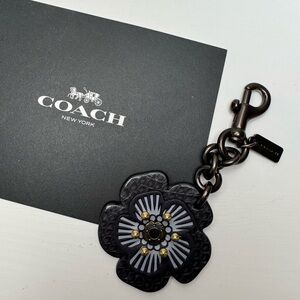 Coach tea rose charm keychain